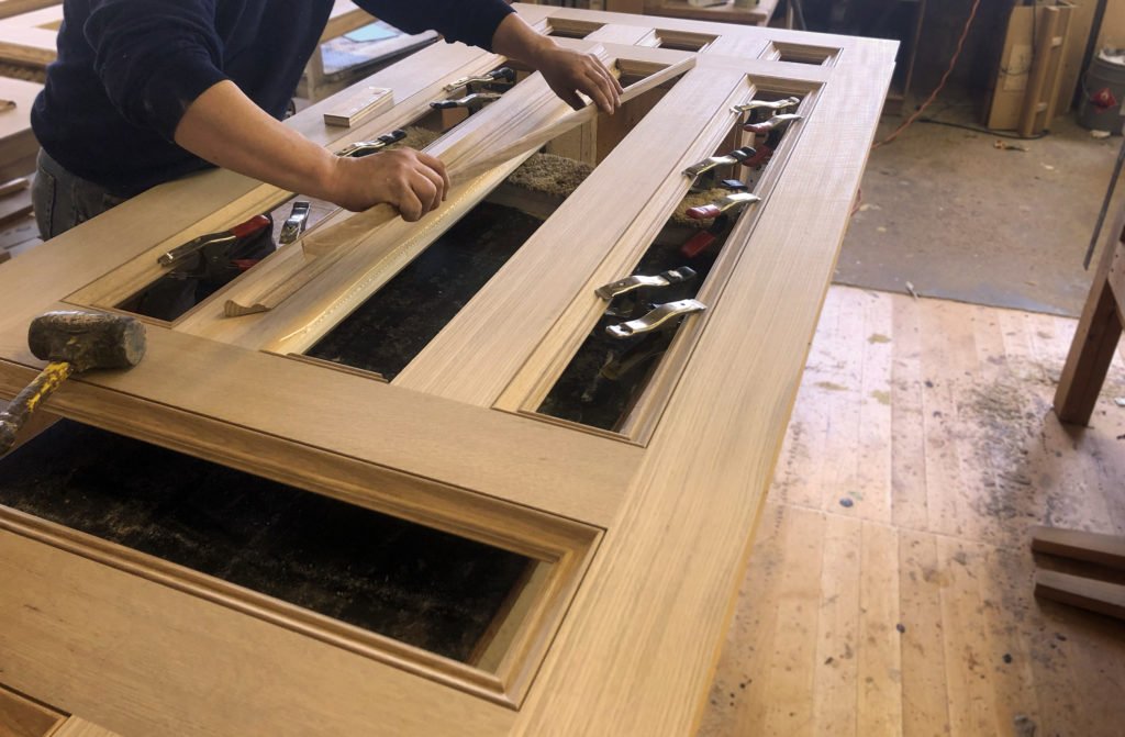 Detailed millwork door sticking profile showing fine machining characteristics achievable with both Sapele and Mahogany lumber