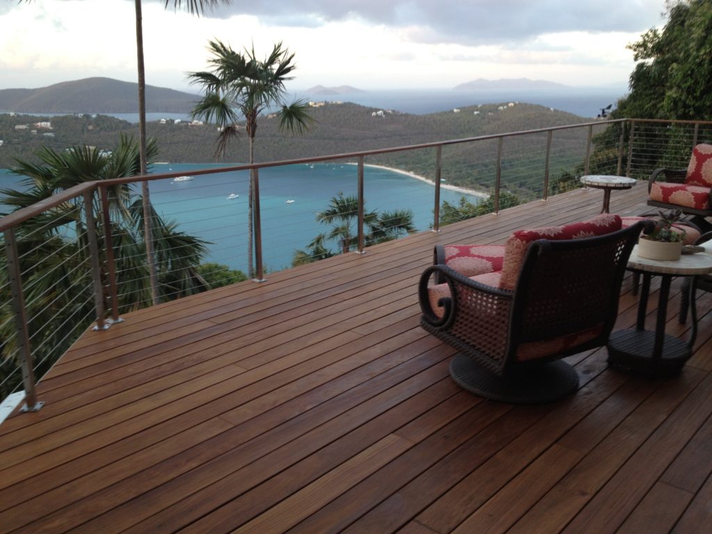 Tropical hardwood deck installation demonstrating the rich brown coloring characteristic of premium hardwood decking in a waterfront application