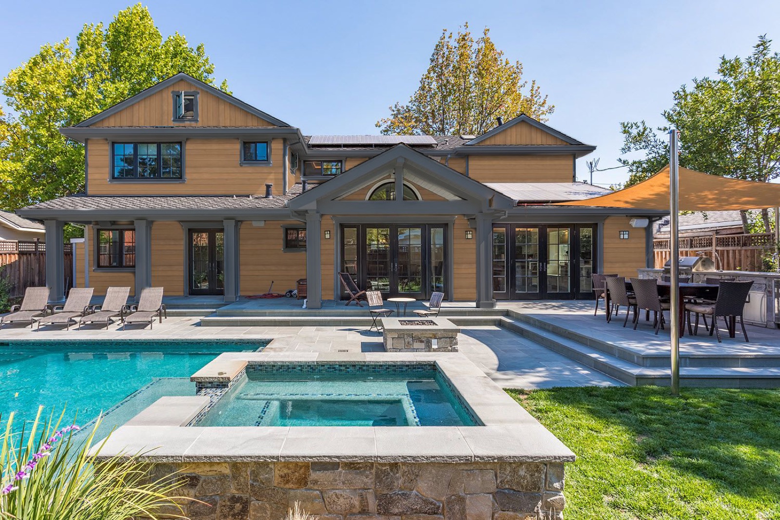 Tropical hardwood pool surround at a coastal residence