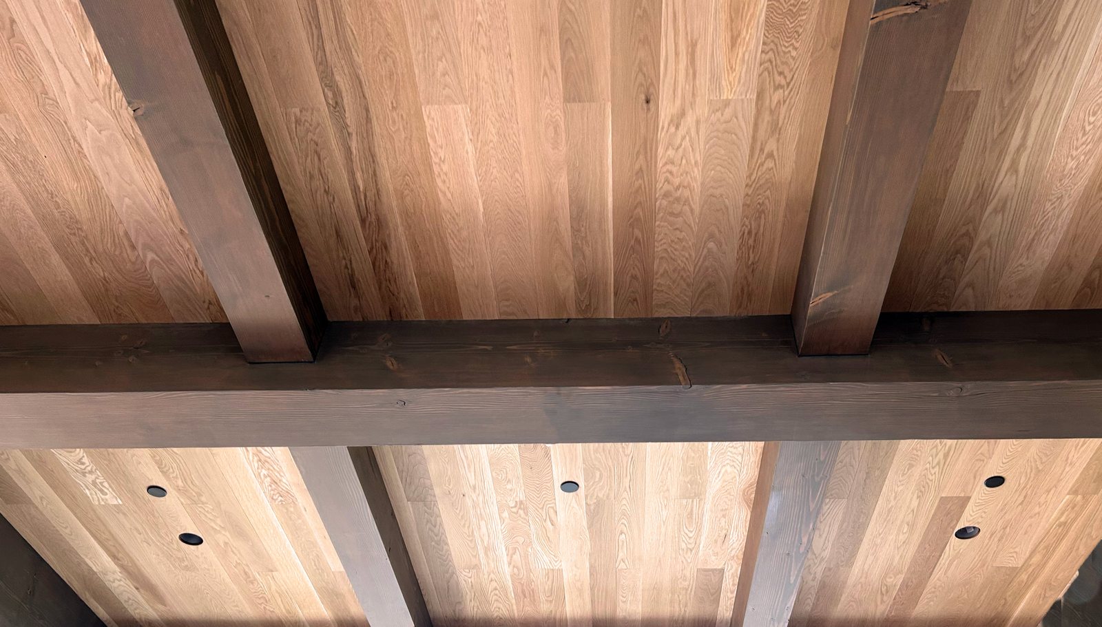 White Oak ceiling boards meeting fir beams at the wall line