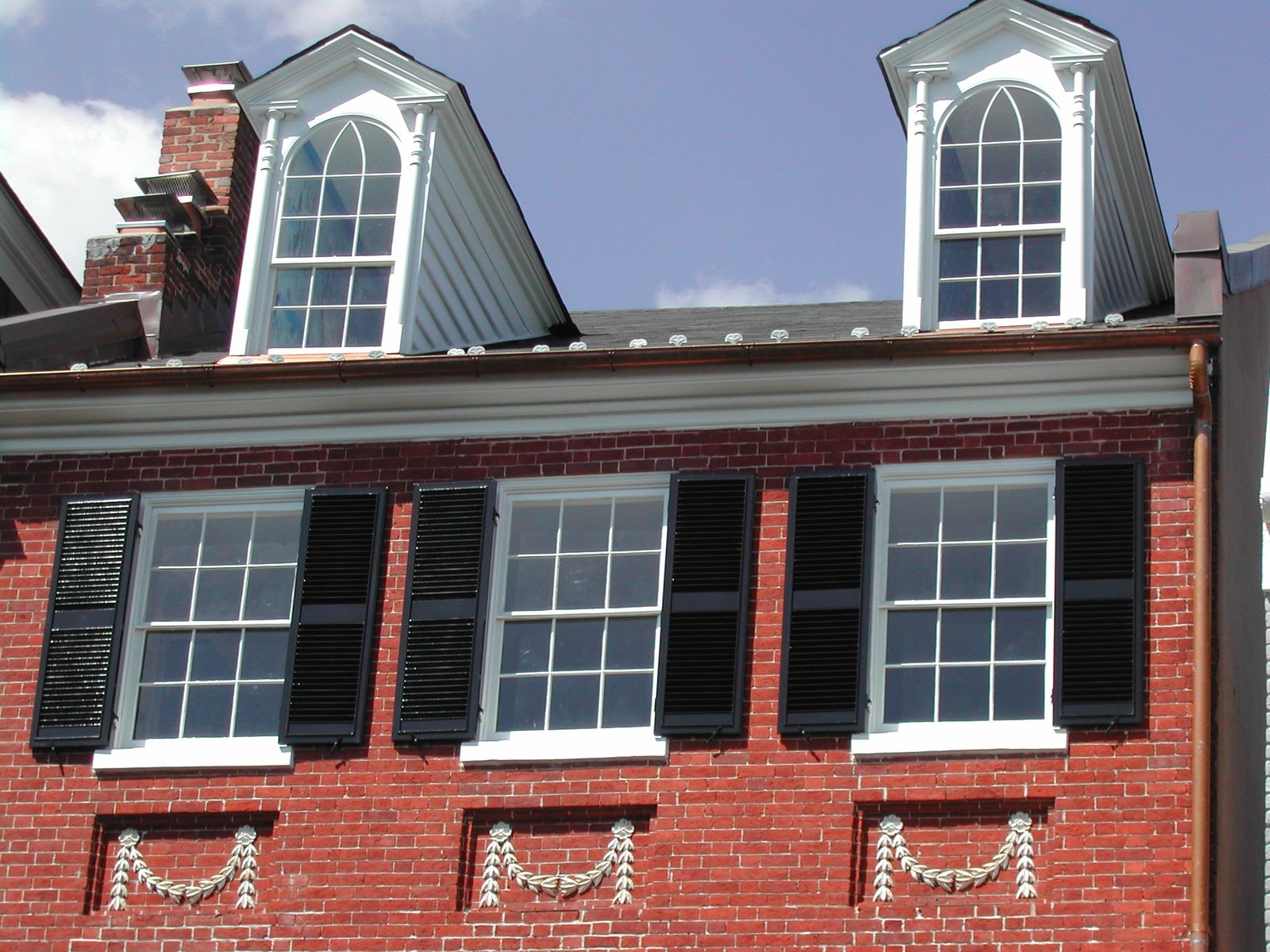Window sills and surrounds set into a brick elevation