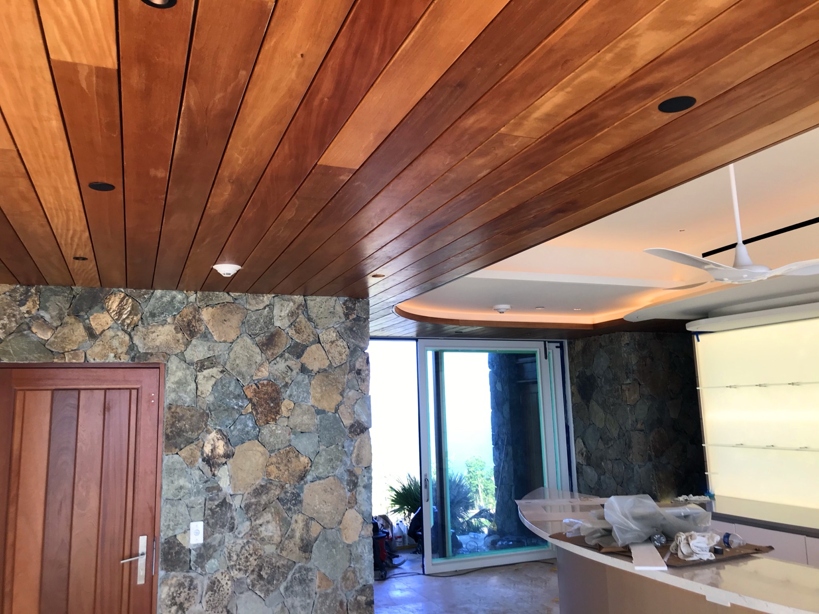 Tropical hardwood ceiling boards at a covered entry