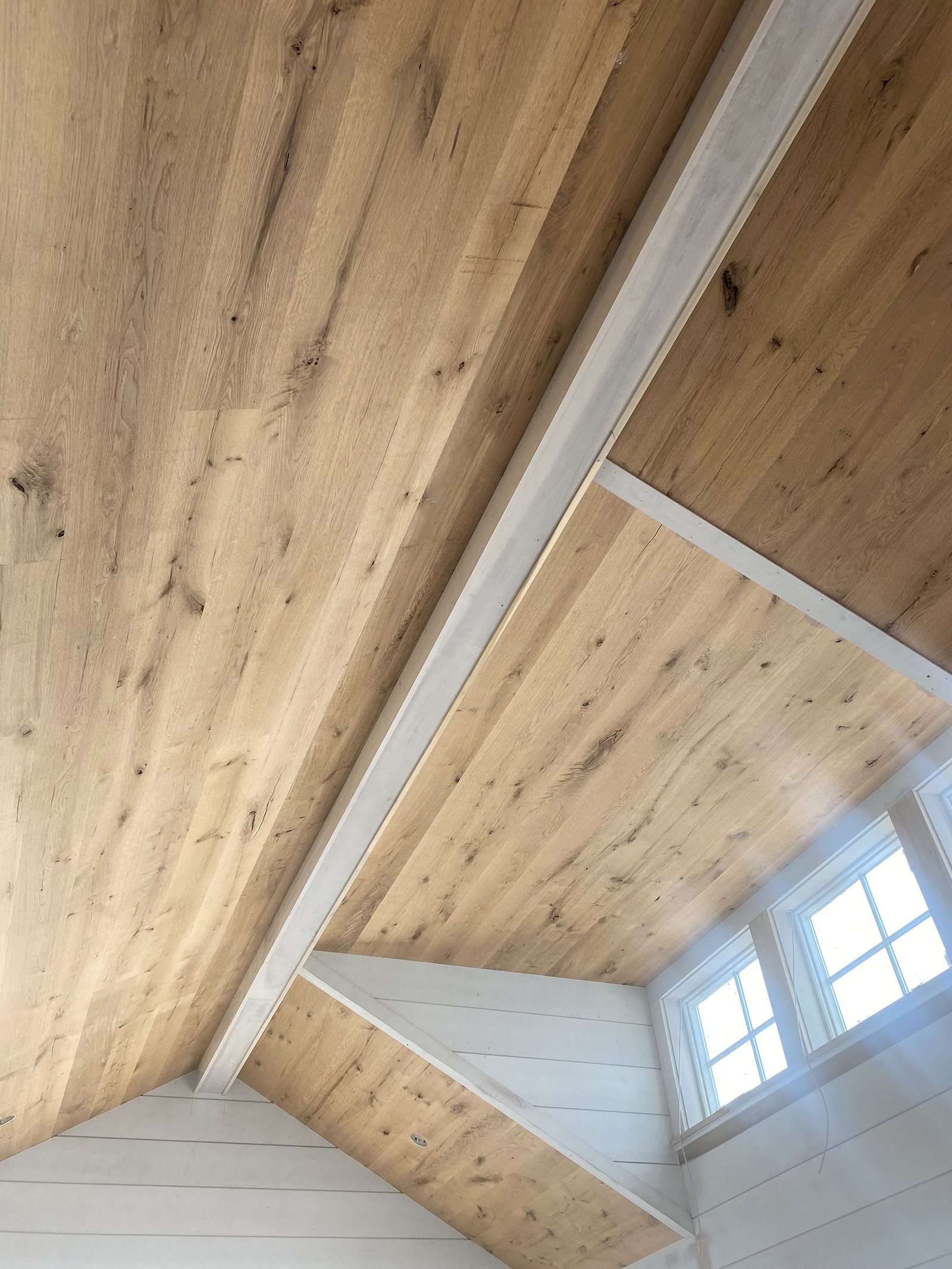 Rustic White Oak ceiling boards showing knots and character marks