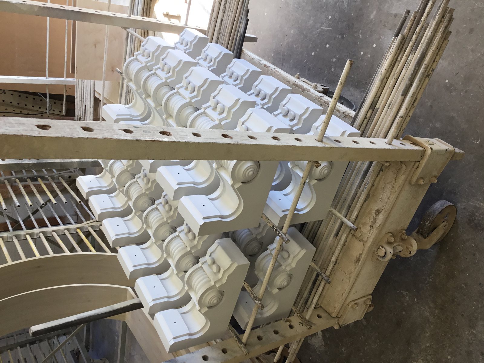 Milled corbels stacked in the shop before finishing