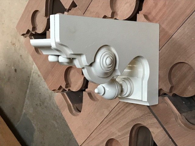 A single corbel assembled, showing how the applied mouldings build the depth