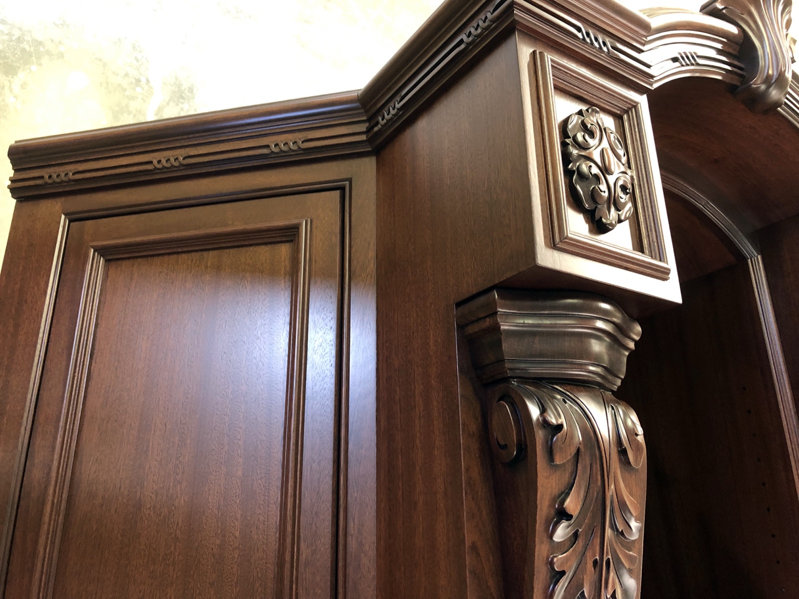 Built up mouldings and a carved corbel on finished casework