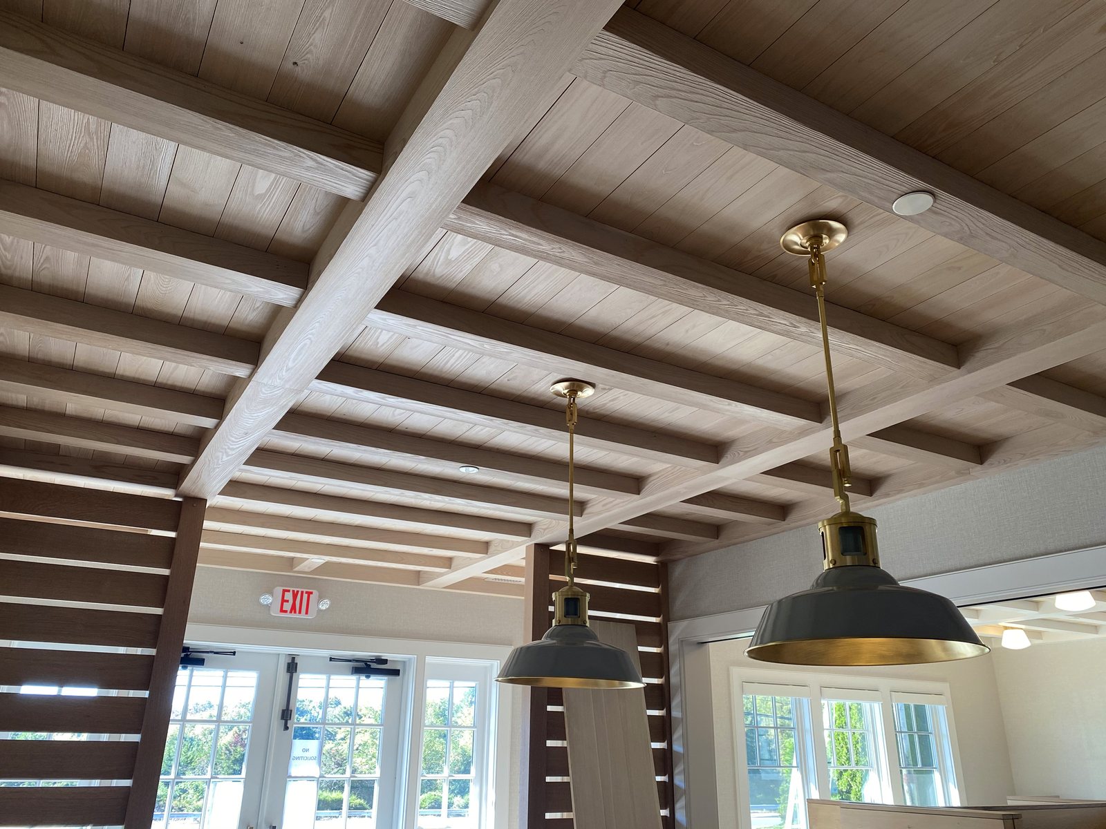 Cypress beams and tongue and groove ceiling seen from the room below