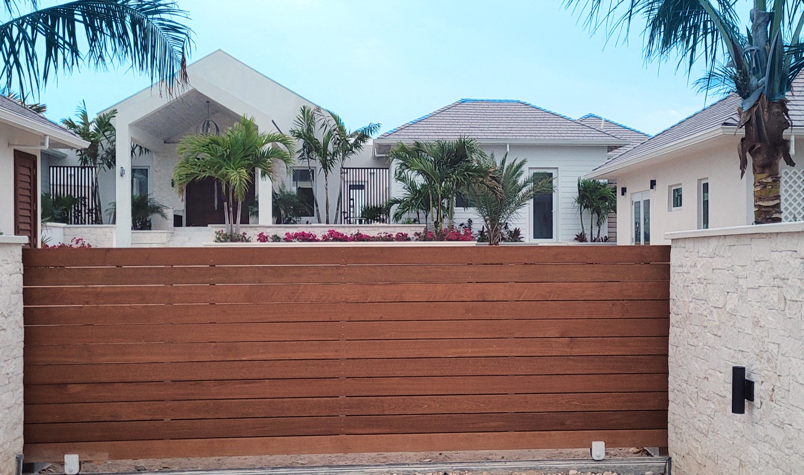 Hardwood gate set into a finished exterior wall