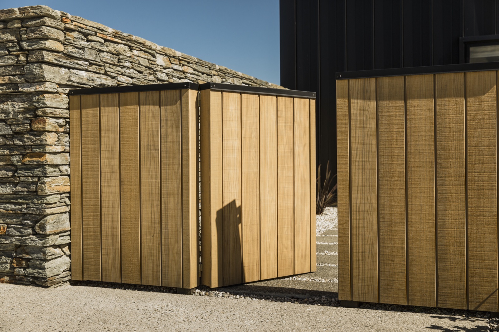 Modified wood fencing in a light finish