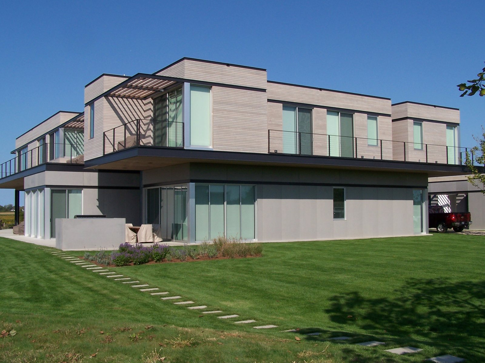 Western Red Cedar clad house seen across a lawn