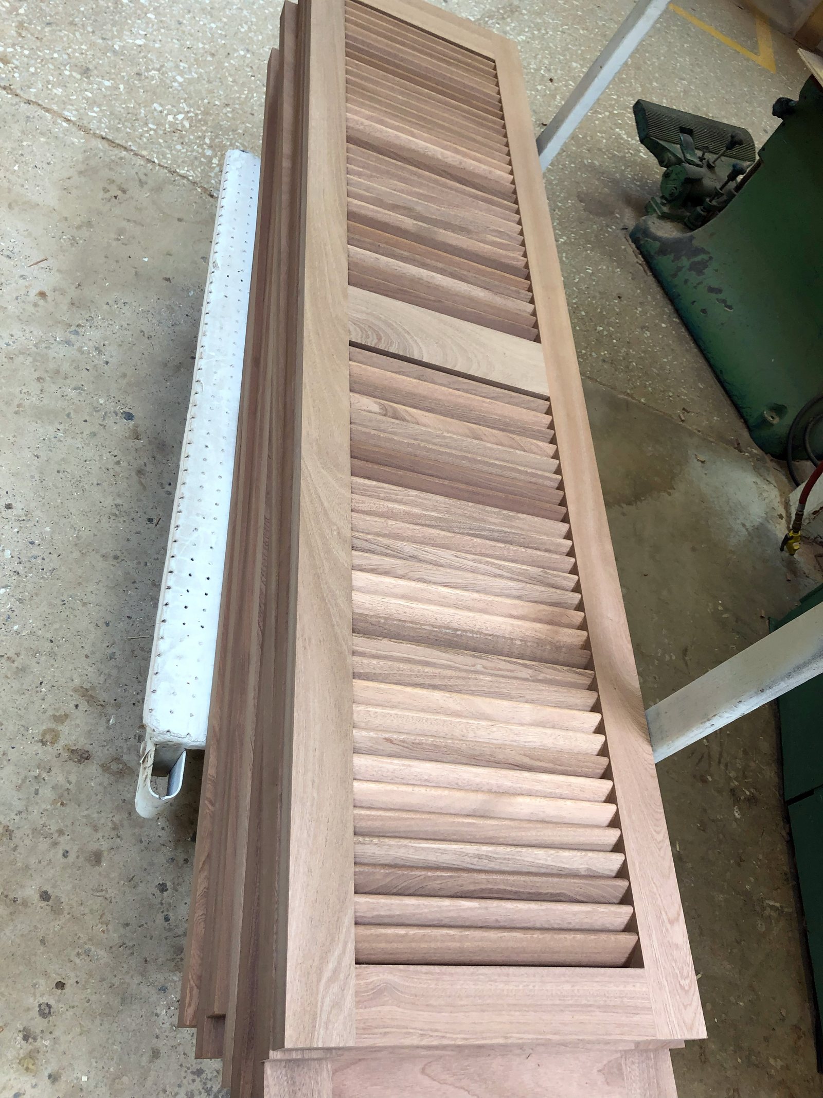 Fixed teak louvered units mounted on an exterior elevation