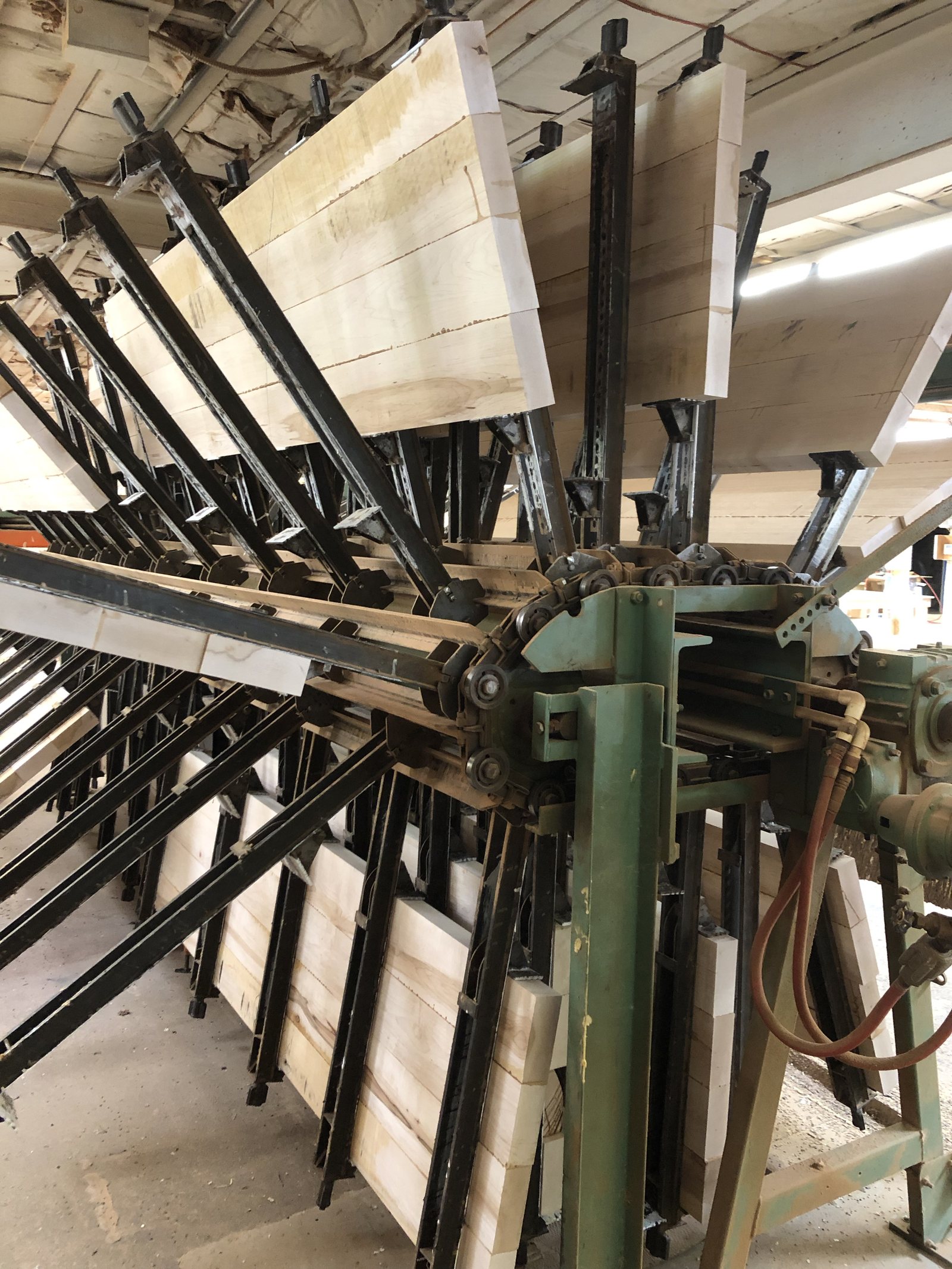 The clamp carousel where panel layups cure flat