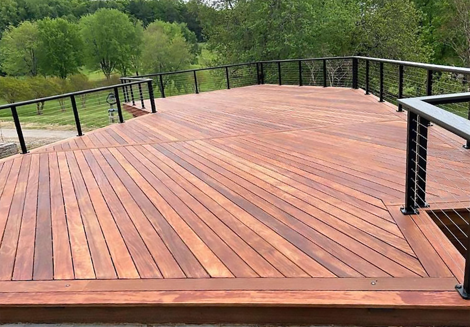 Tropical hardwood deck in a wooded, high rainfall setting