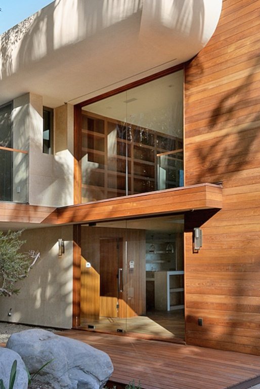 Wood cladding and soffit meeting at a building corner