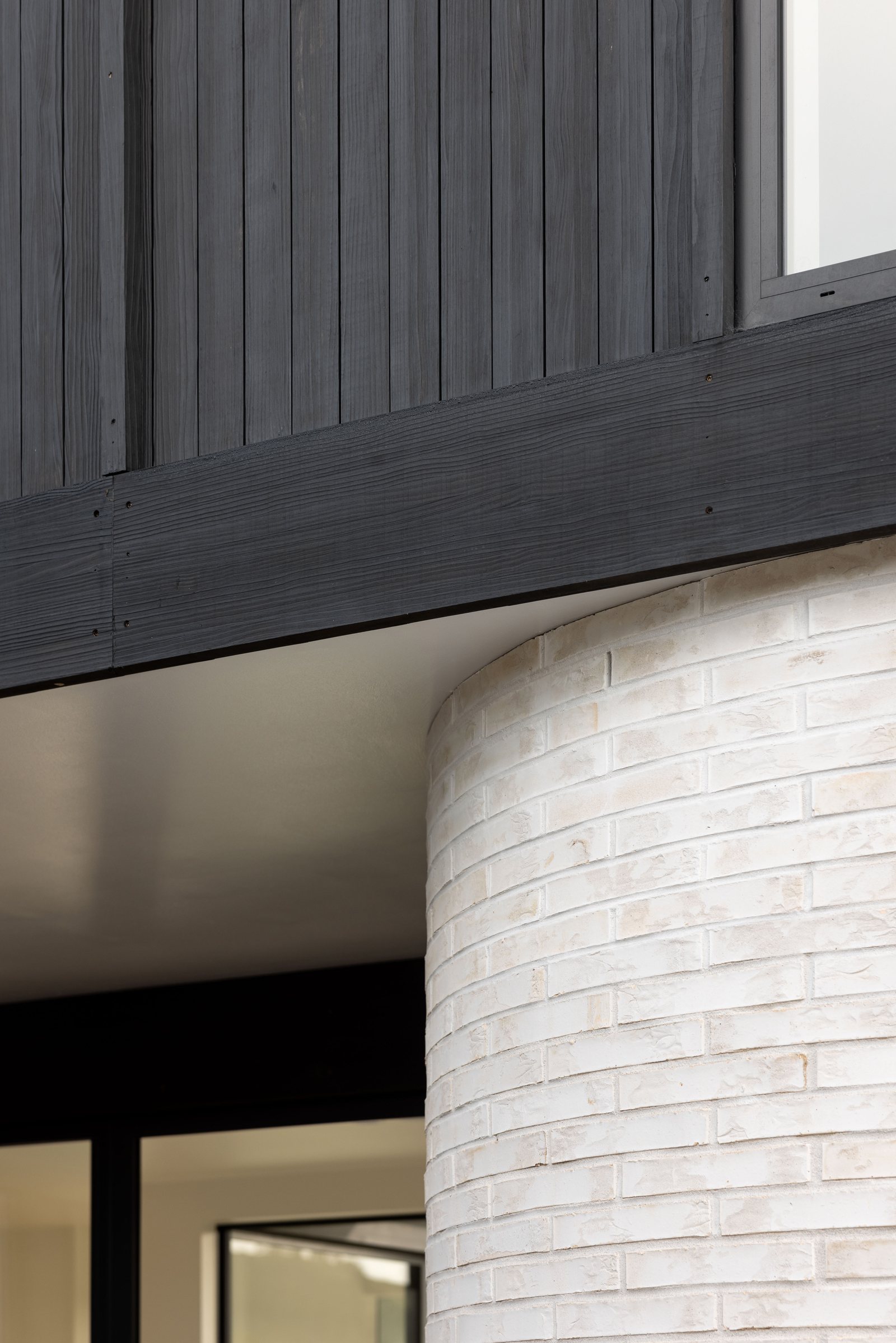 Wide modified fascia board with a dark finished face