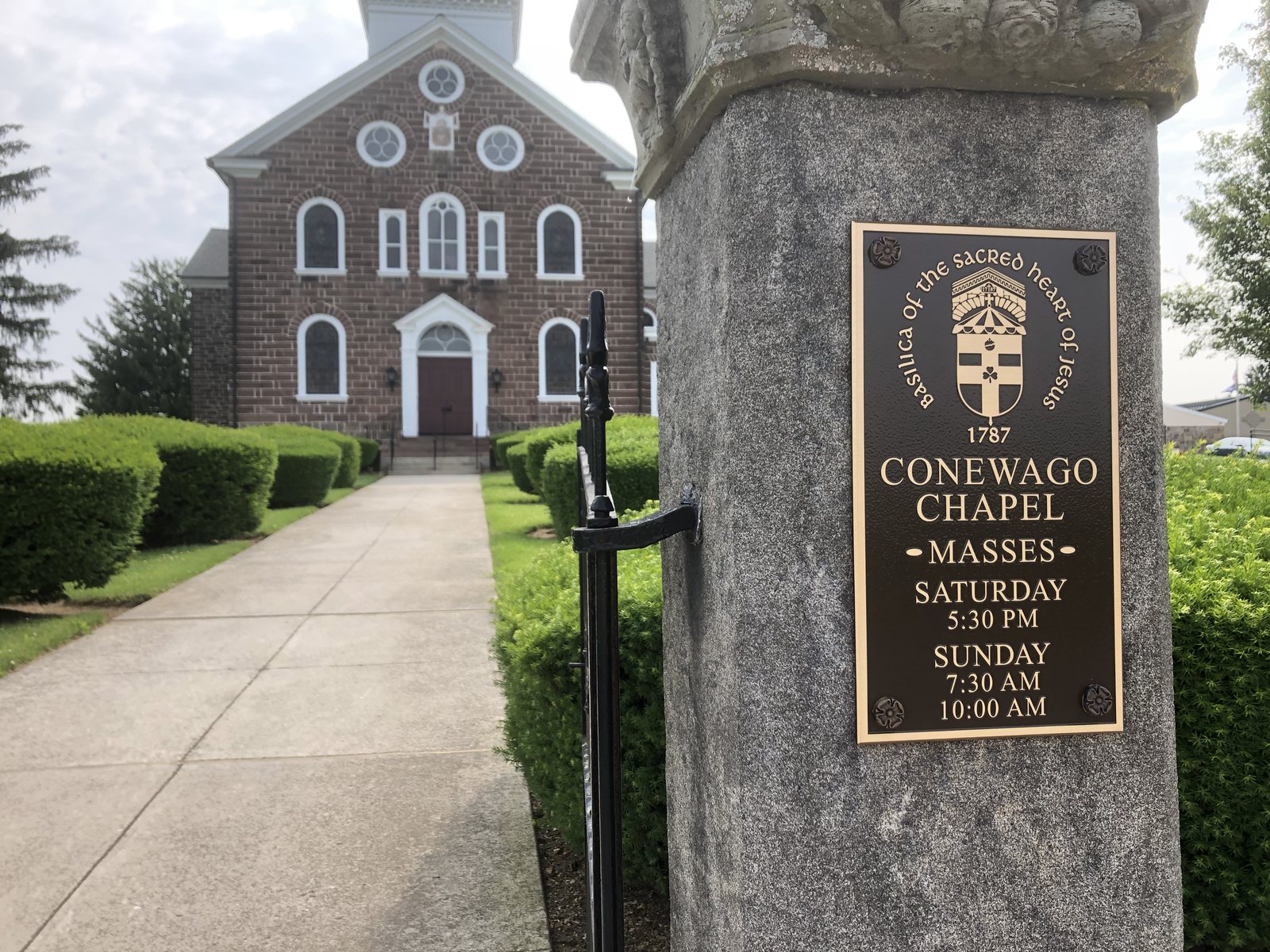Chapel signage post beside the finished walk