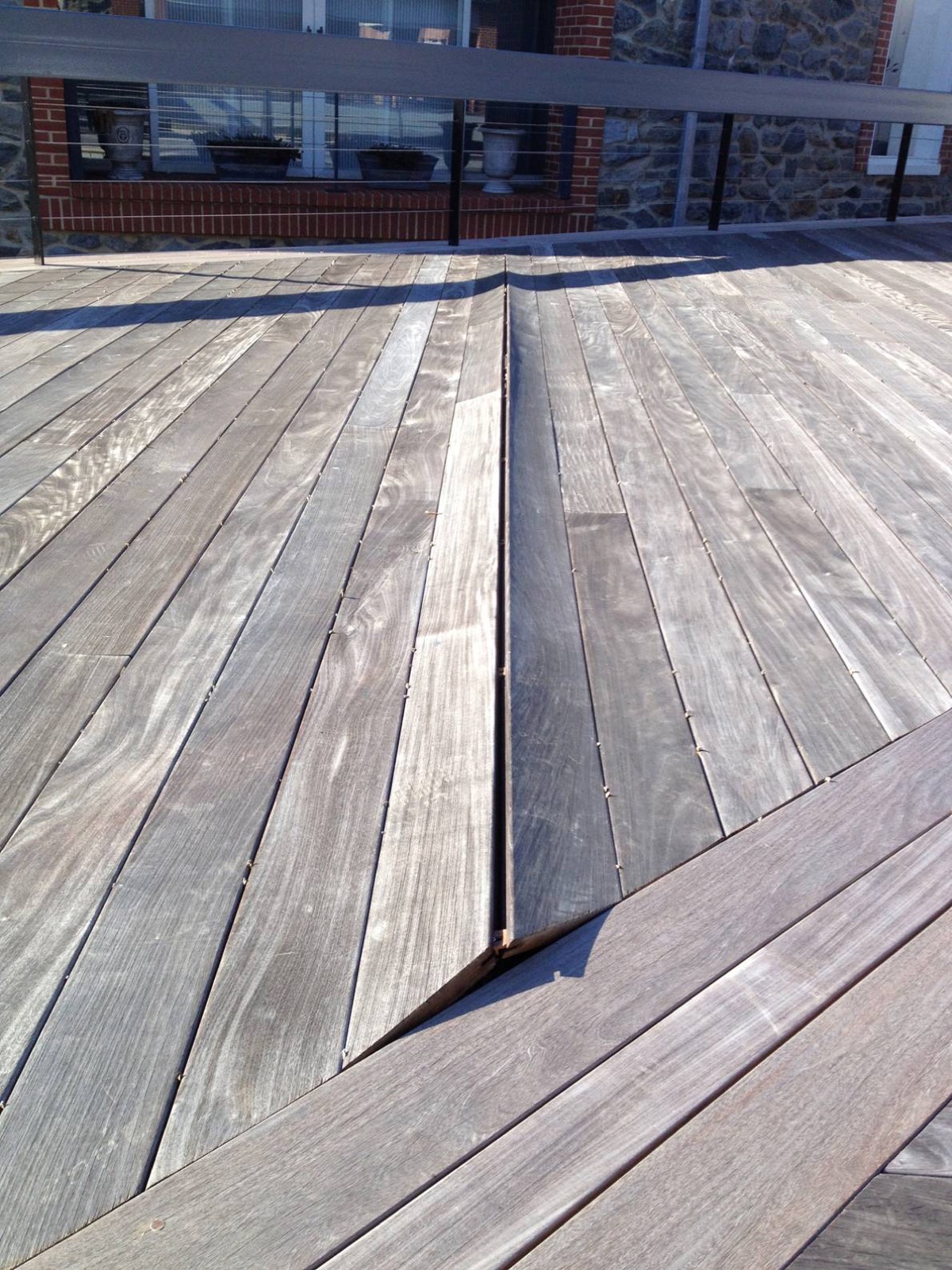 Deck boards showing movement from moisture and heat