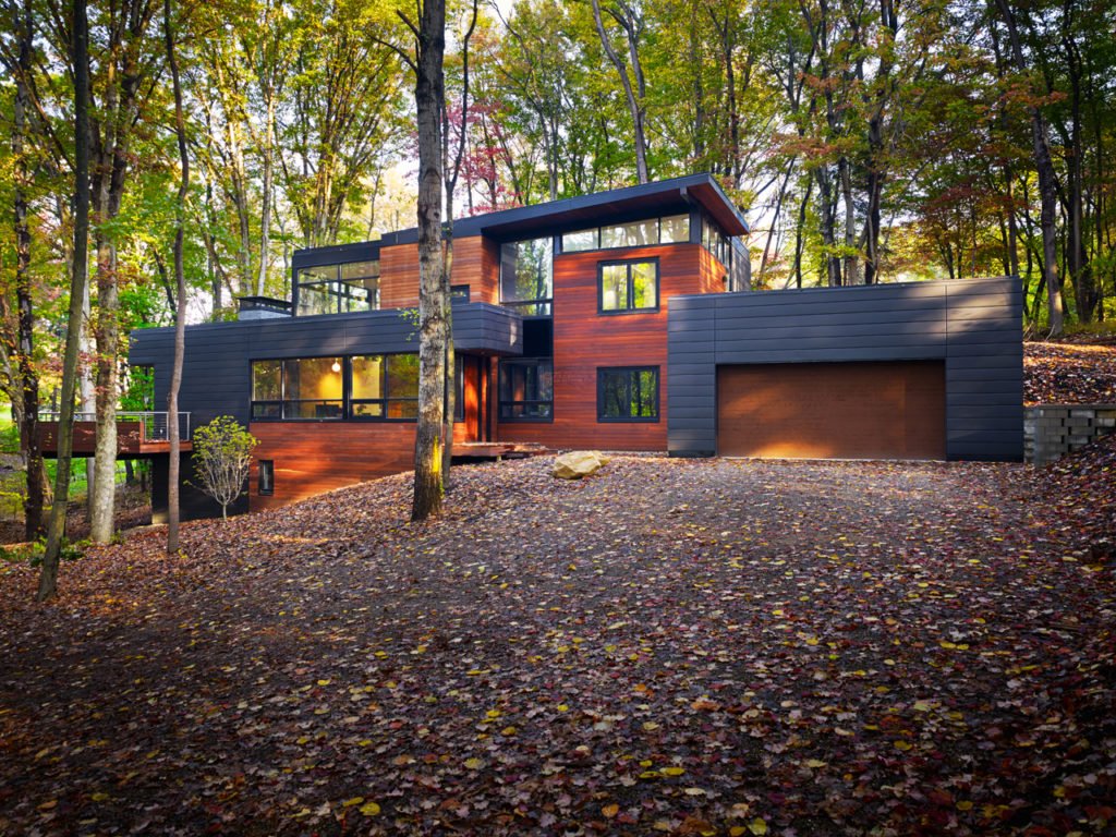 Tropical hardwood siding and decking installation on residential project — FSC-certified Jatoba (Brazilian Cherry) available from Norm Moton