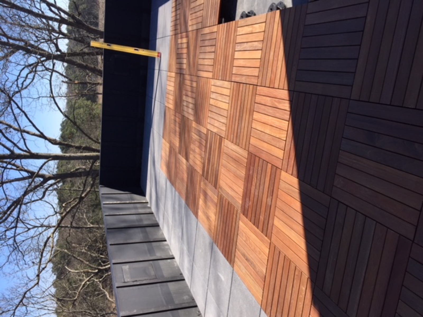 Tropical hardwood deck tiles laid on a terrace