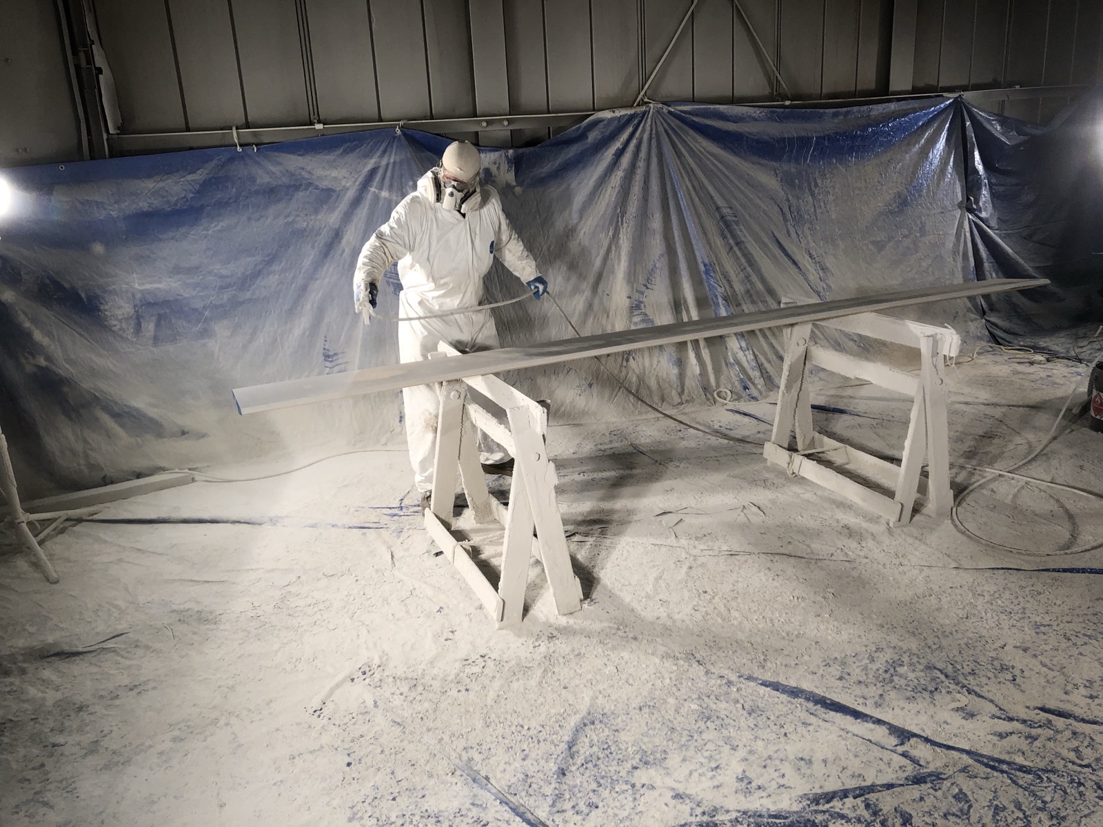 Moulding being primed in the finishing room