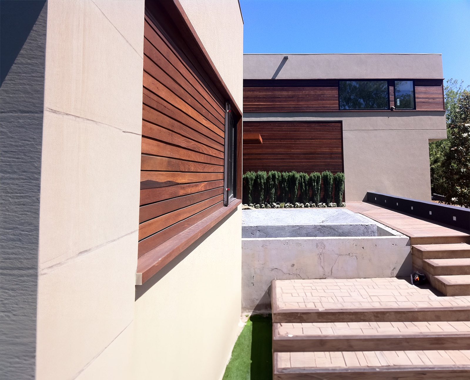 Ipe cladding on a completed elevation, with the entry steps in place