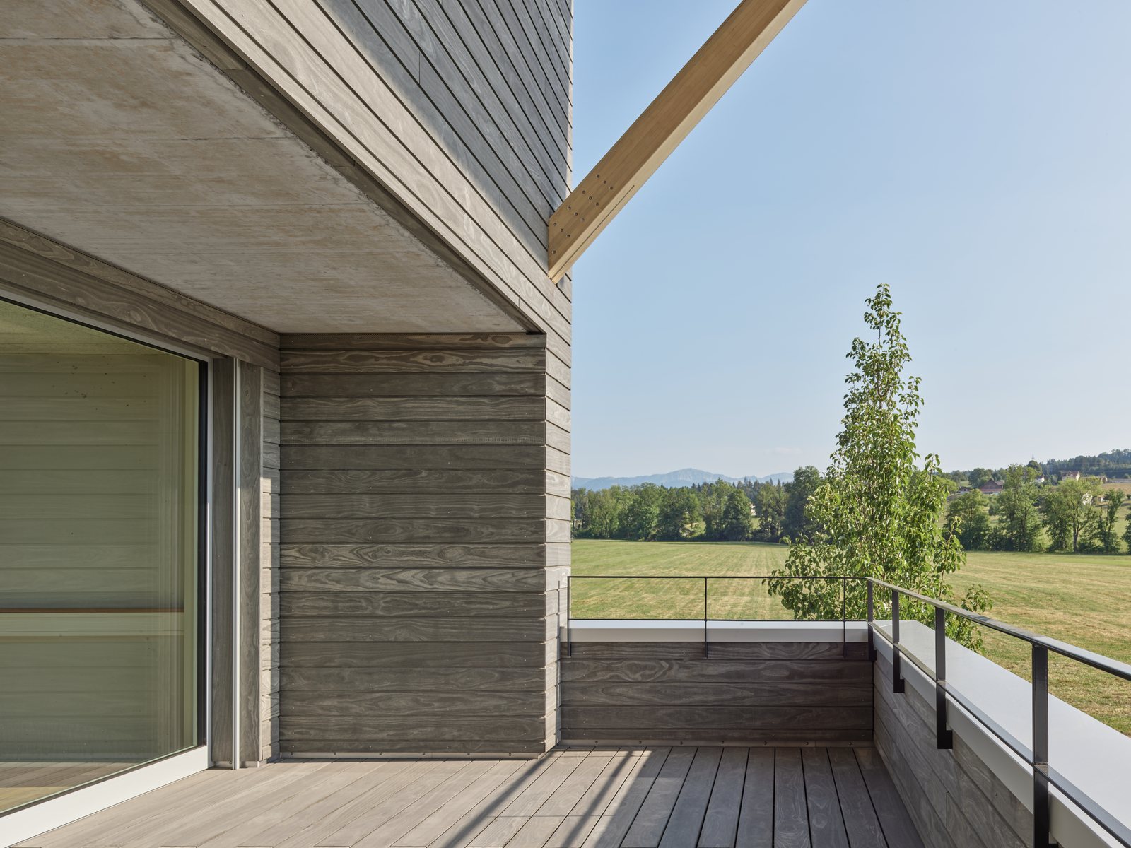 Modified cladding weathered in place over a full elevation