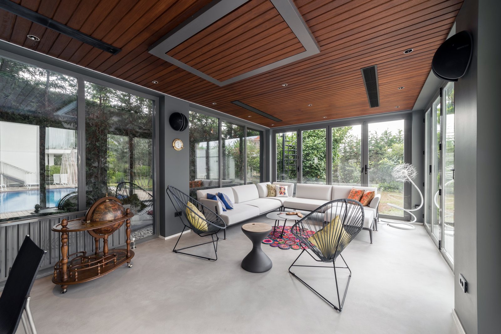 Modified Iroko ceiling boards run through a conditioned interior