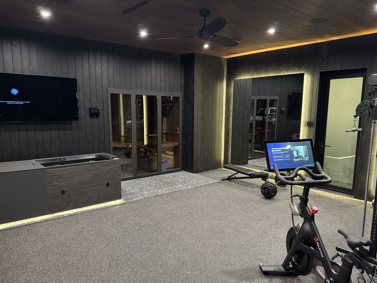 Interior with slatted wood wall panelling running the length of the room