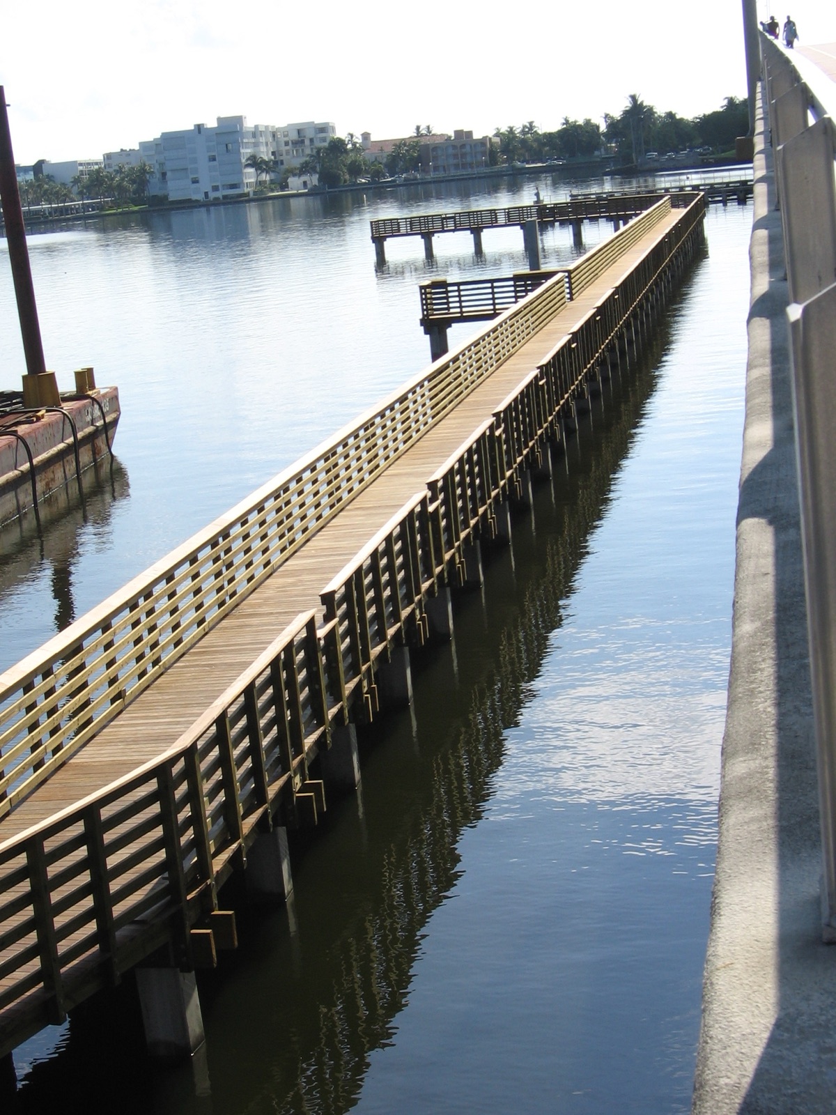 Tropical hardwood pier over calm water