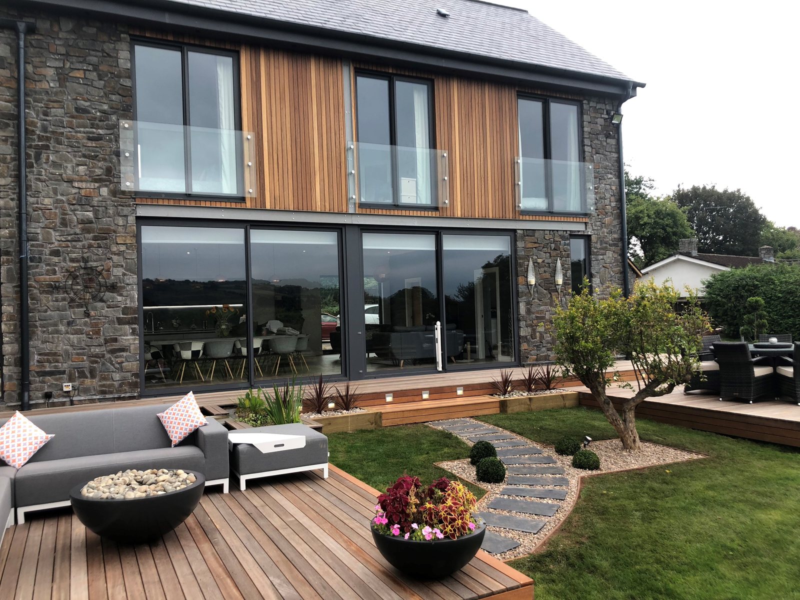 Terrace deck and cladding around a fire pit