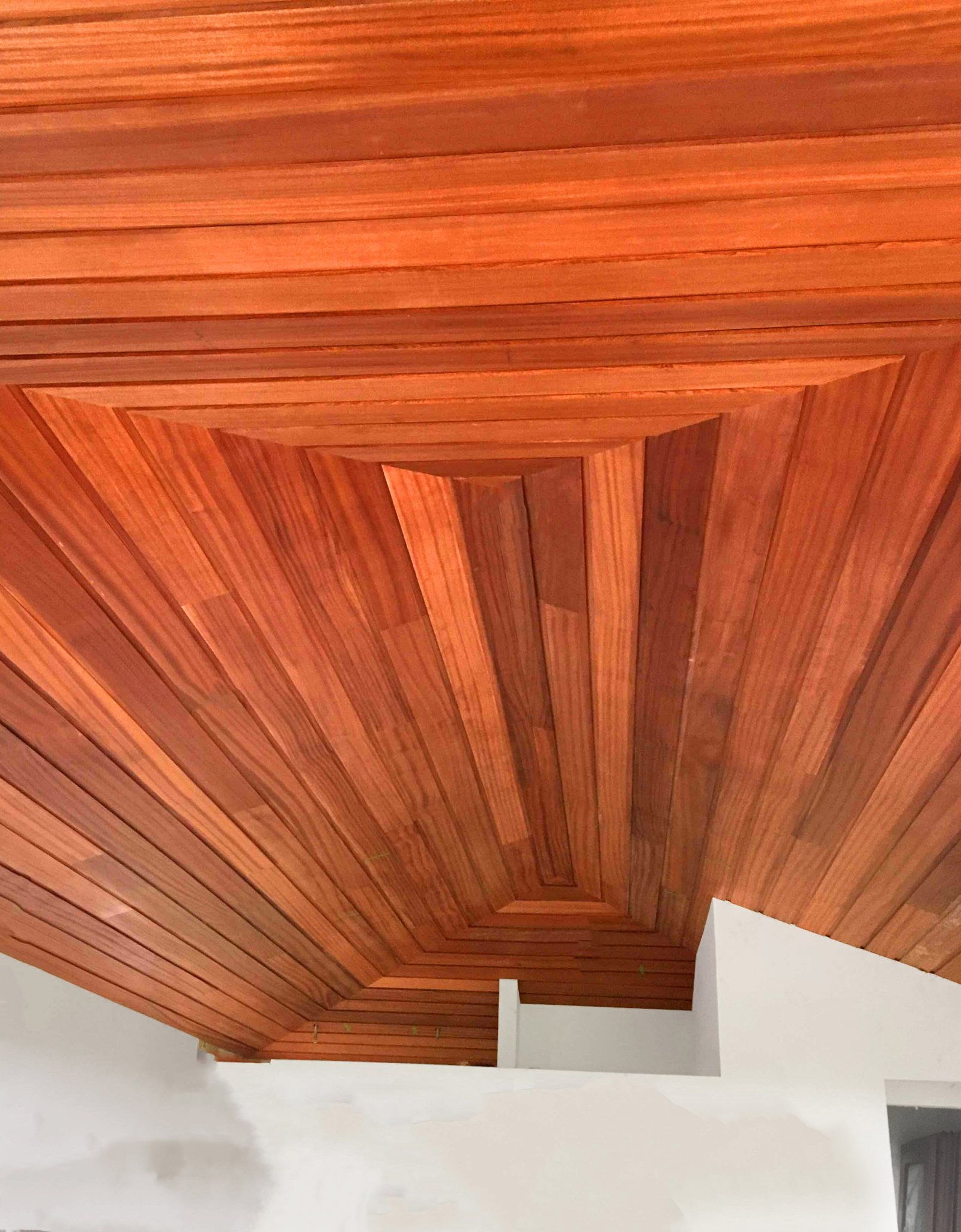Sapele lap ceiling boards run to a moulded profile