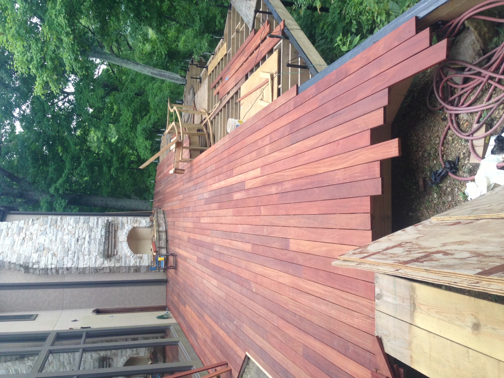 Cumaru decking being installedd with clip fasteners