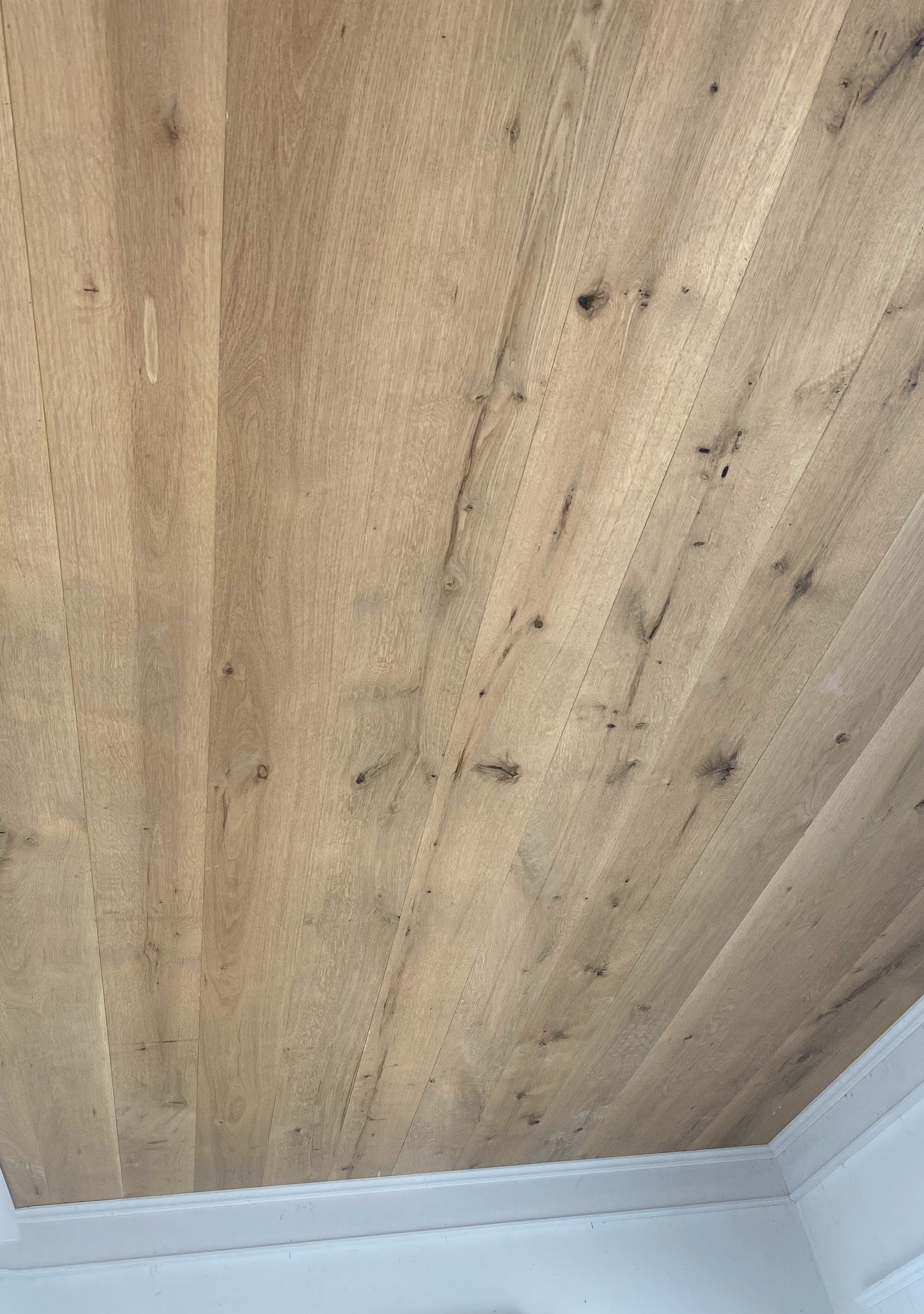 White Oak ceiling boards meeting the wall line