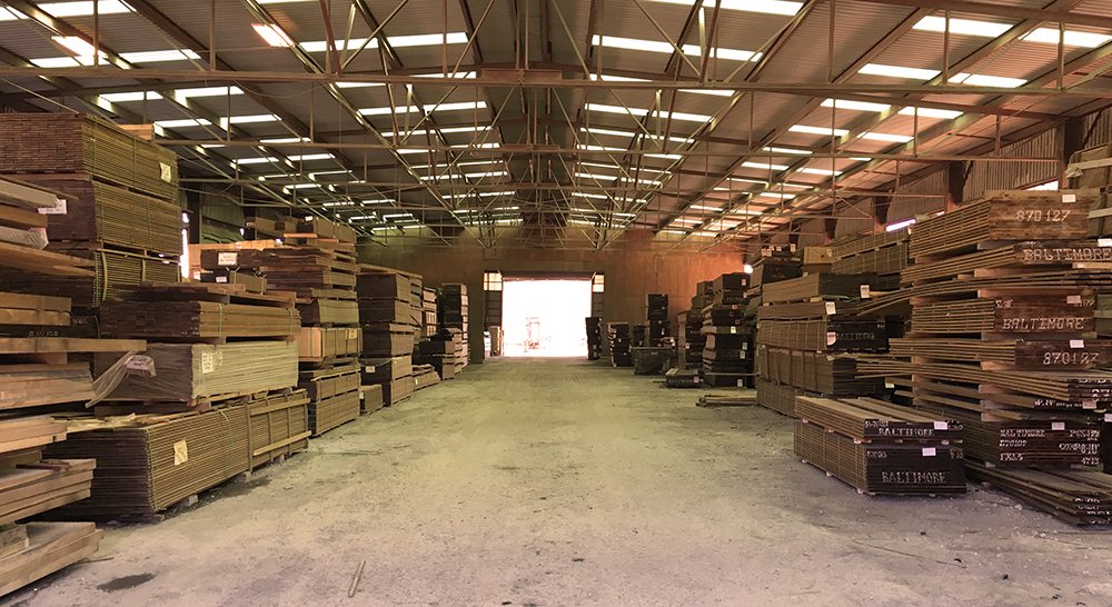 Lumber held indoors, which is what makes a reserved lot survive a phased job