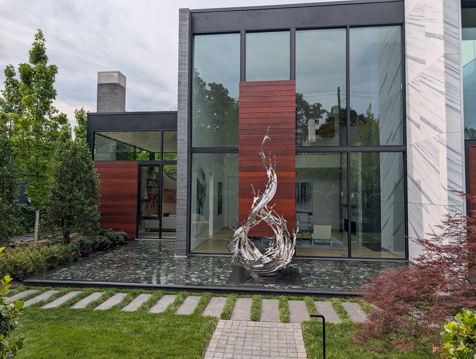 Sapele cladding and a metal feature wall on the same facade