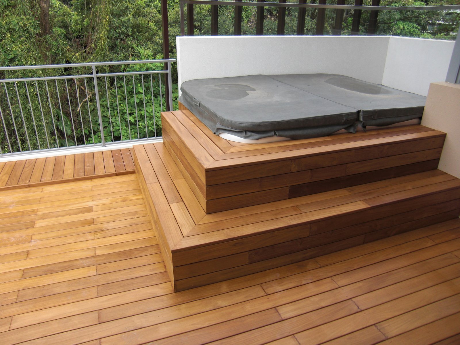 A teak deck and step platform run from the same narrow stock