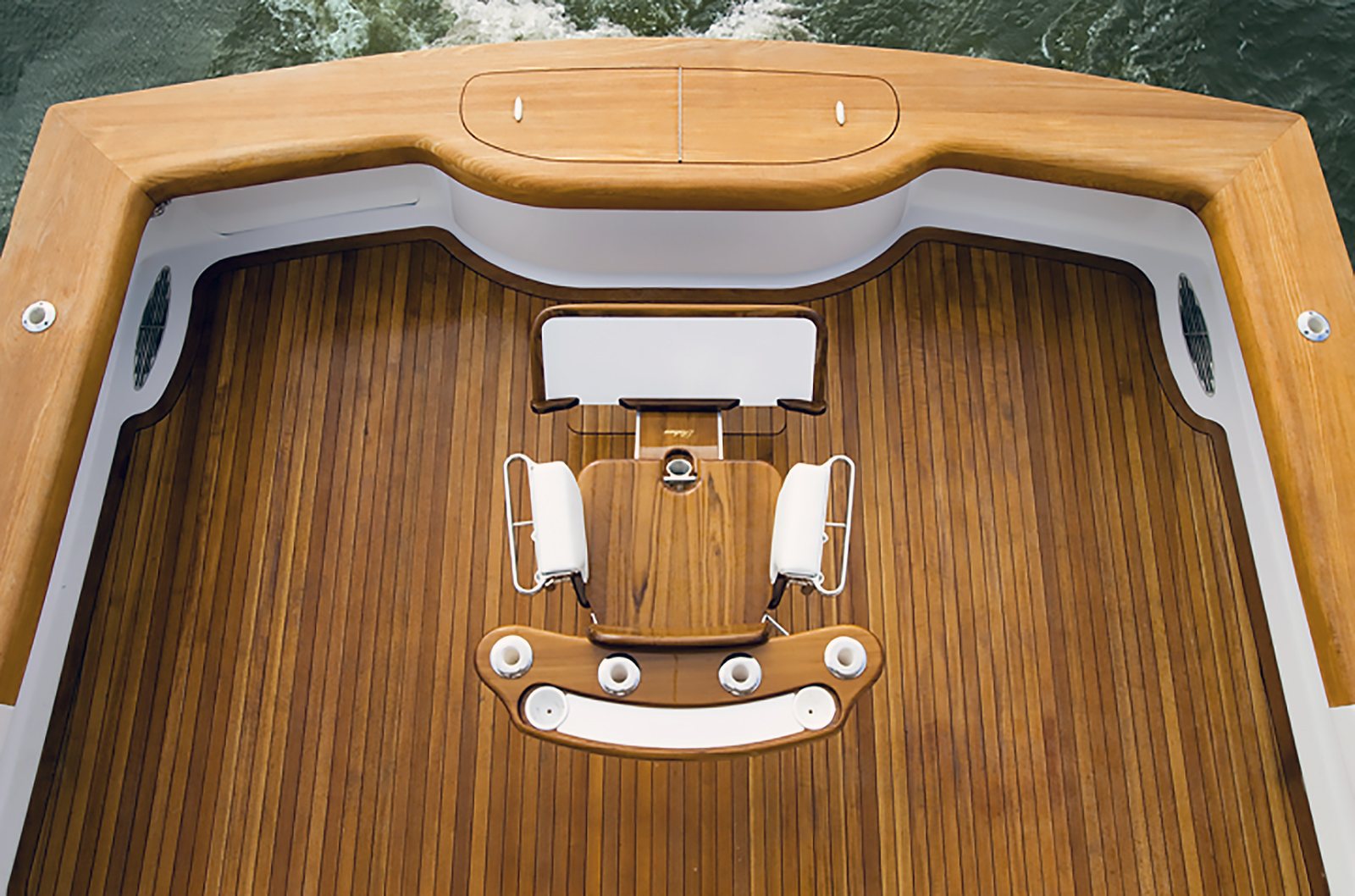 A transom and coaming carrying the same schedule across a horizontal and a vertical face