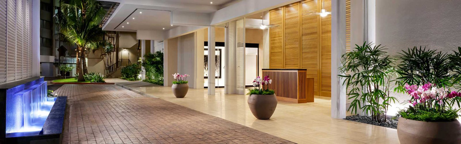 A lobby run of teak that has to read as one body of material