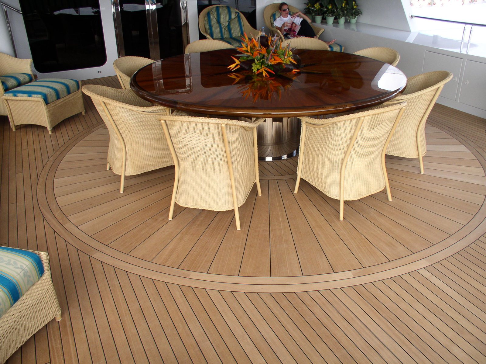 Teak decking run at a stated width with the seams holding parallel