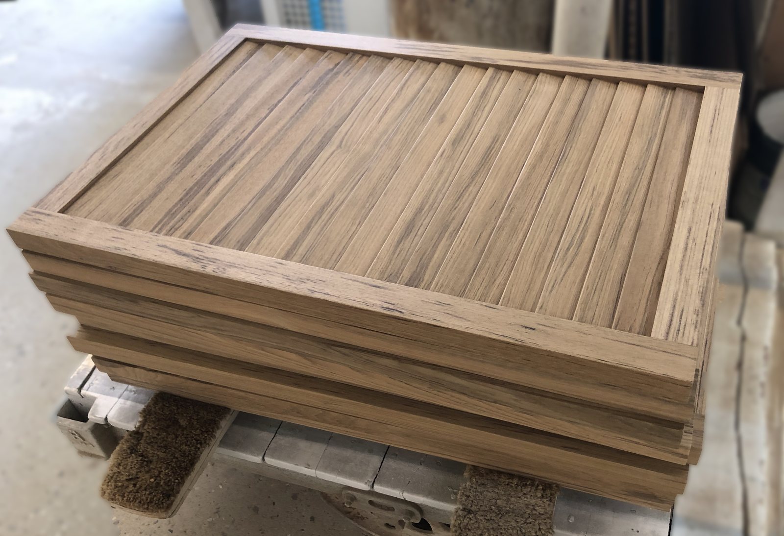 A teak panel assembly with its solid edge components run from the same material