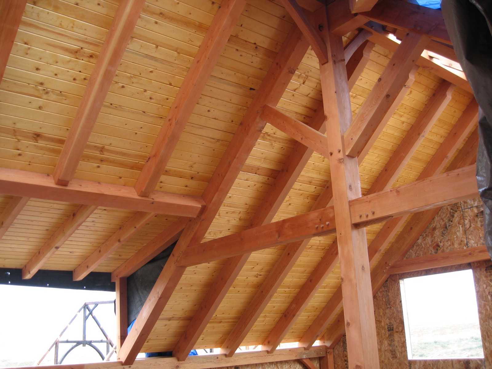 Fir tongue and groove ceiling above an exposed timber truss