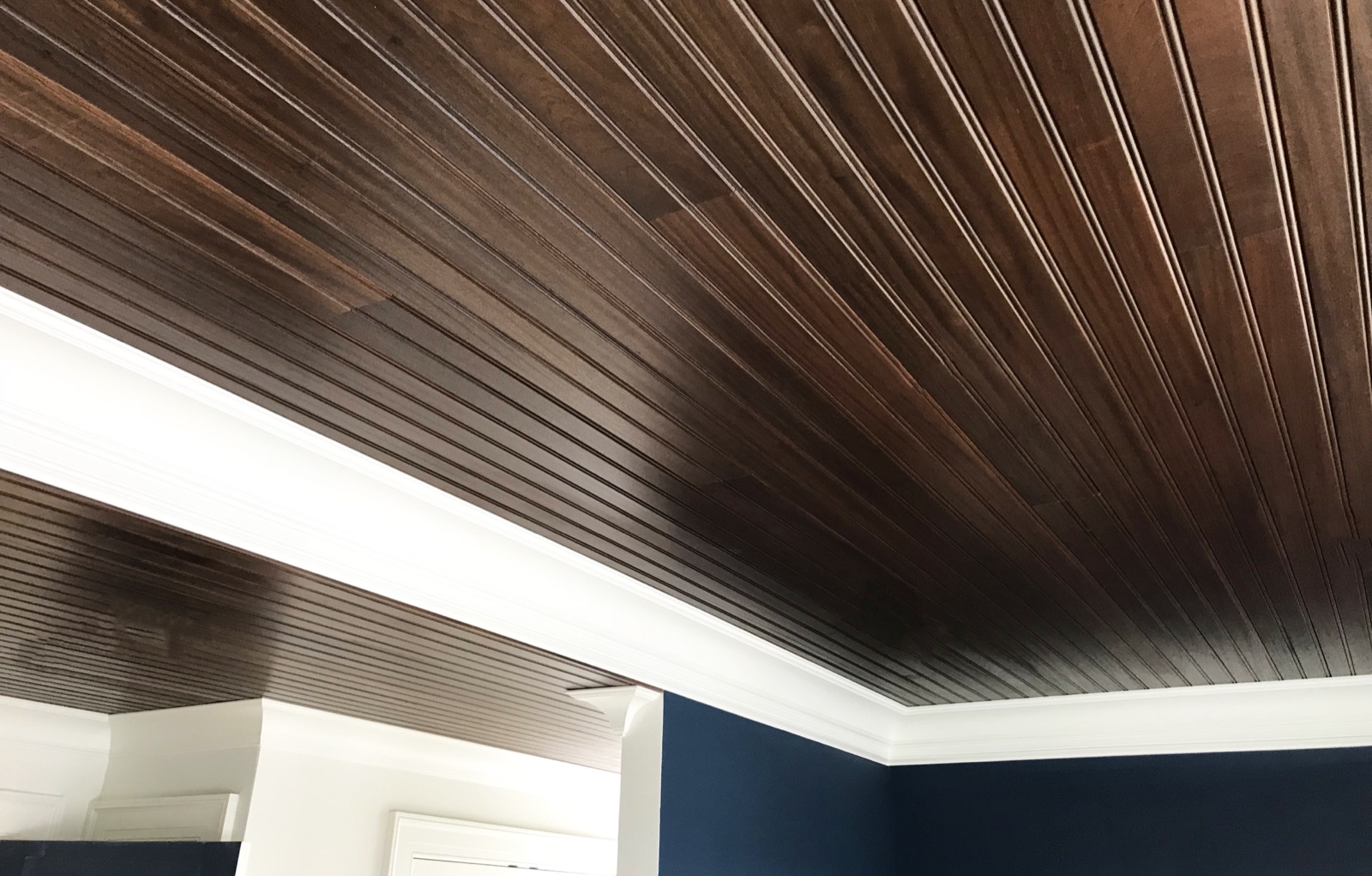 Narrow beaded Sapele ceiling boards in a dark finish