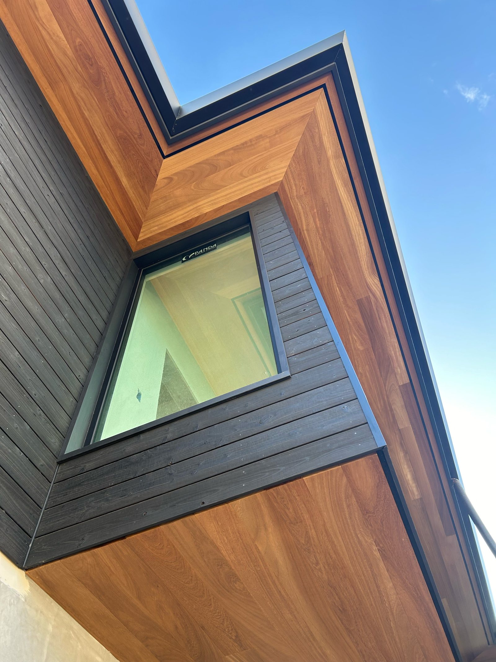 Iroko soffit running along an overhang to its return