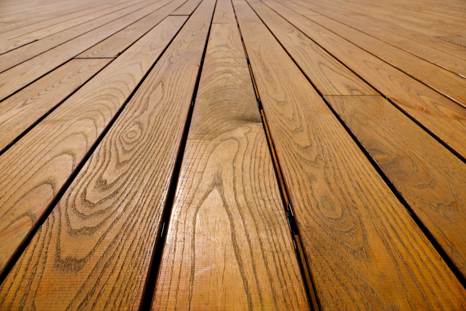 Deck board and fastener detail on a finished surface