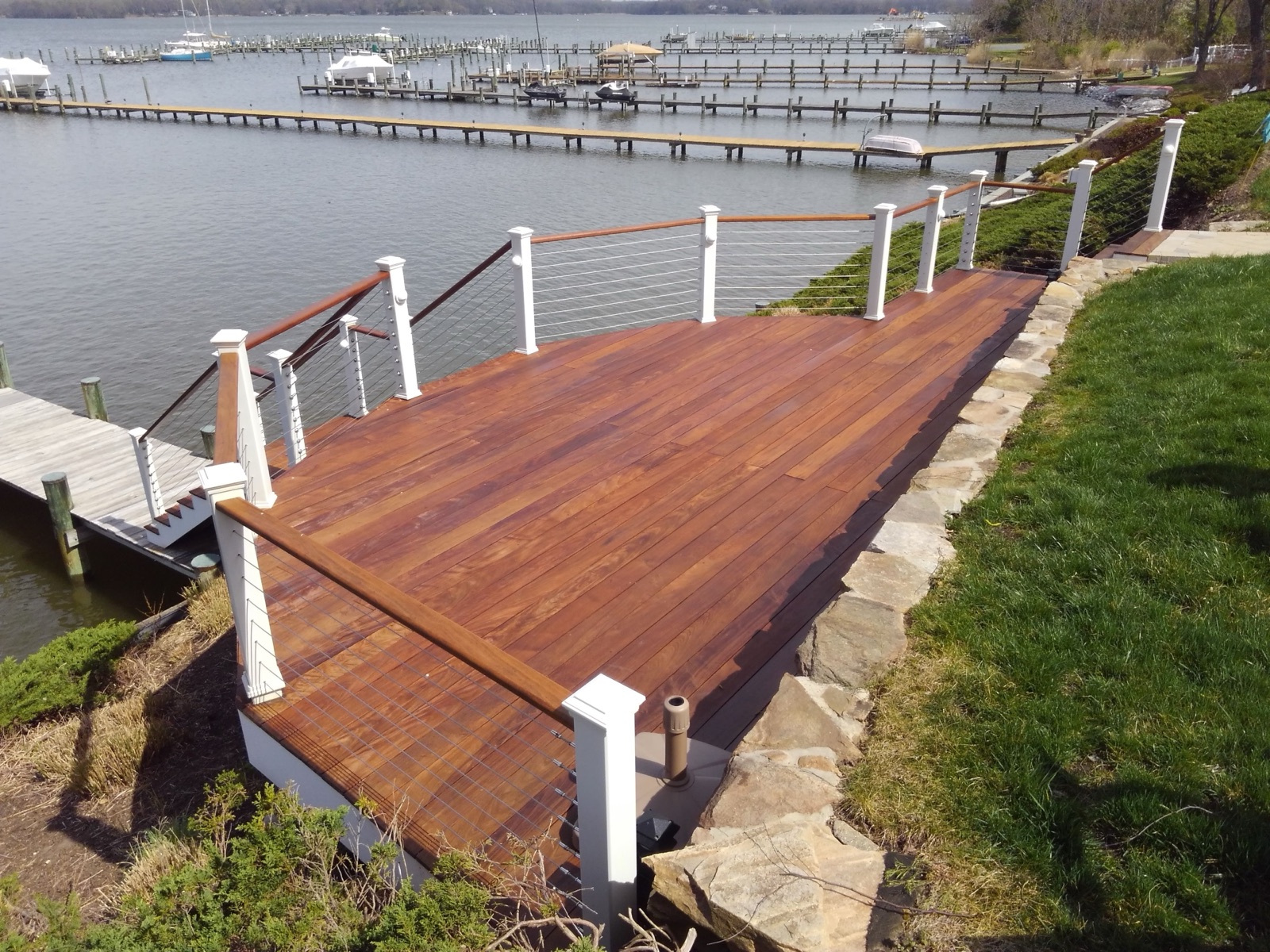 Tropical hardwood dock walkway detailed for drainage