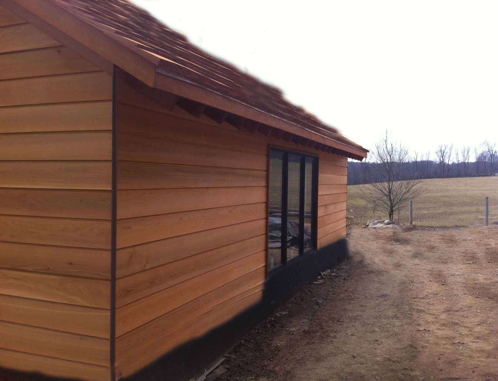 Freshly finished Western Red Cedar cladding on a wall