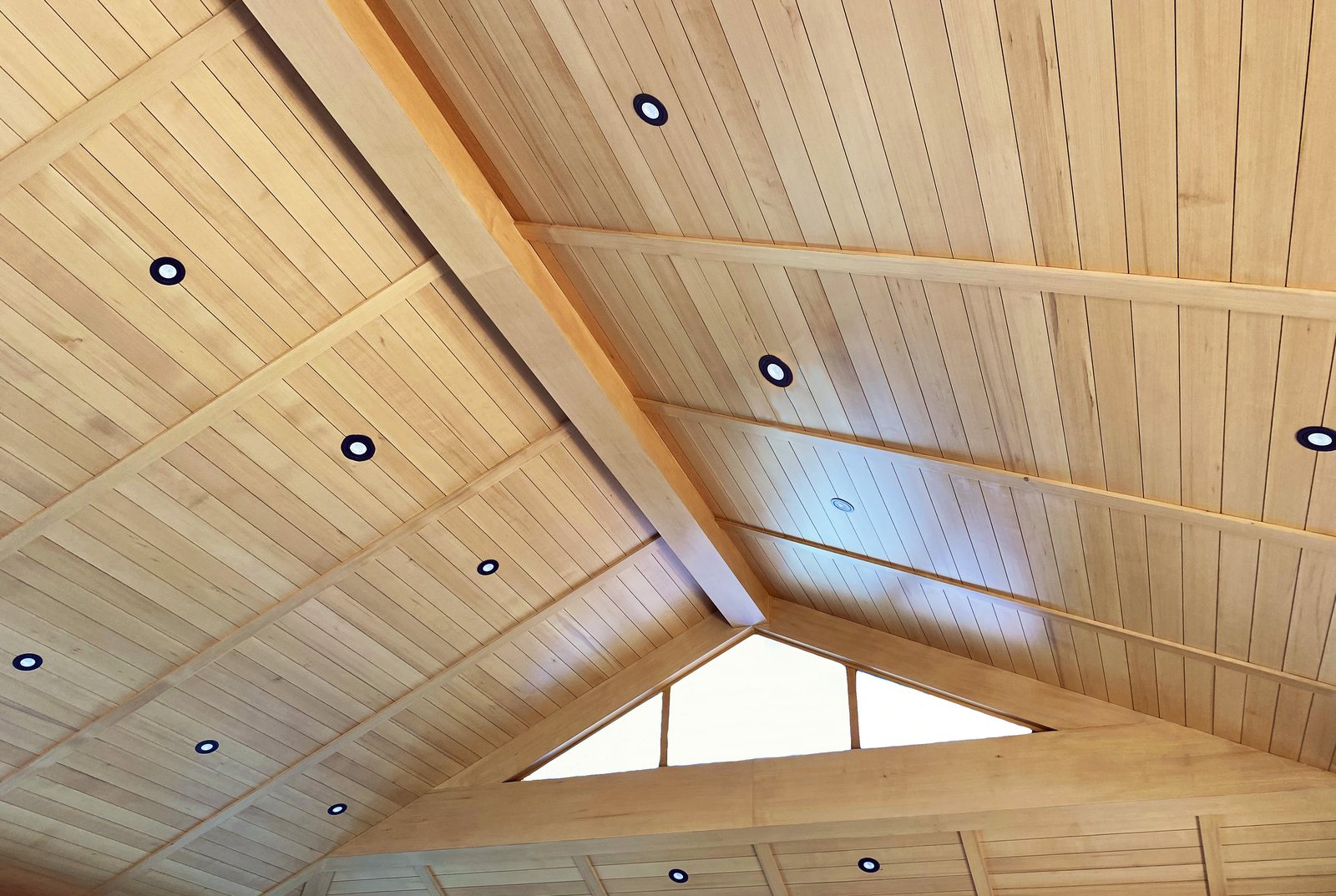 Tongue and groove ceiling boards running to a ridge